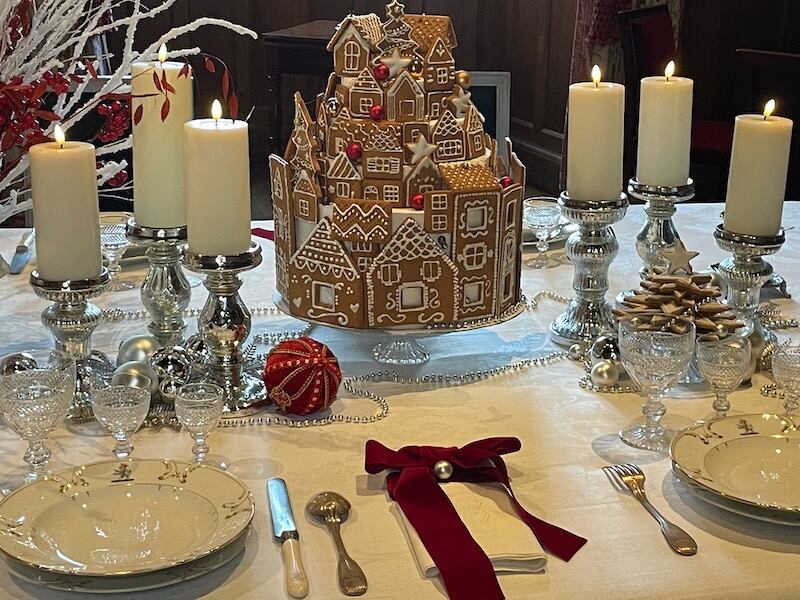 A giant gingerbread centerpiece on a table with candles at Azay-le-Rideau castle at Christmas