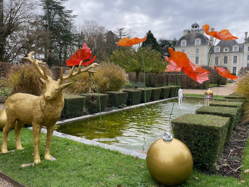 Apprentice's Garden at Cheverny Castle, with the pond in the foreground and the castle in the back