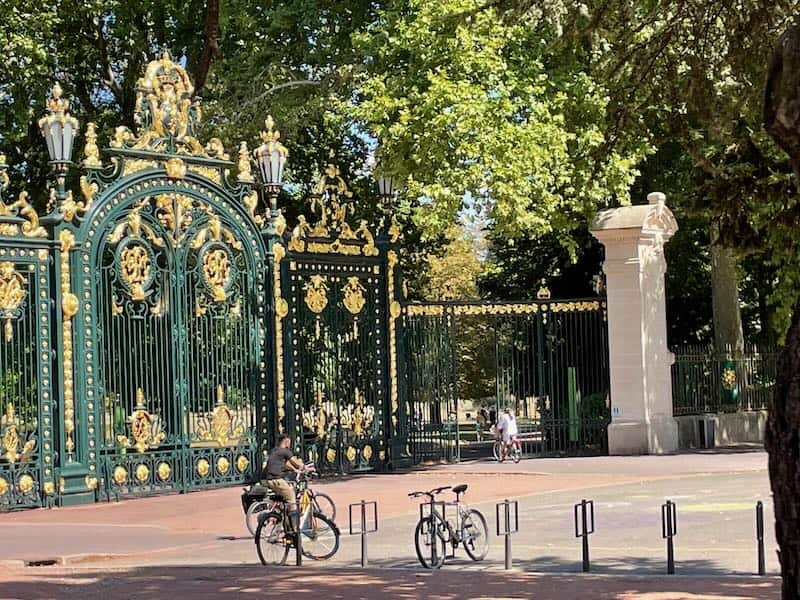 Lyon - what to do on a summer day? Head for these giant gold-tipped wrought-iron entrance gates to Parc de la Tete d'Or