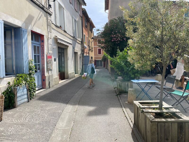 Narrow shady street in Isle sur la Sorgue in Provence