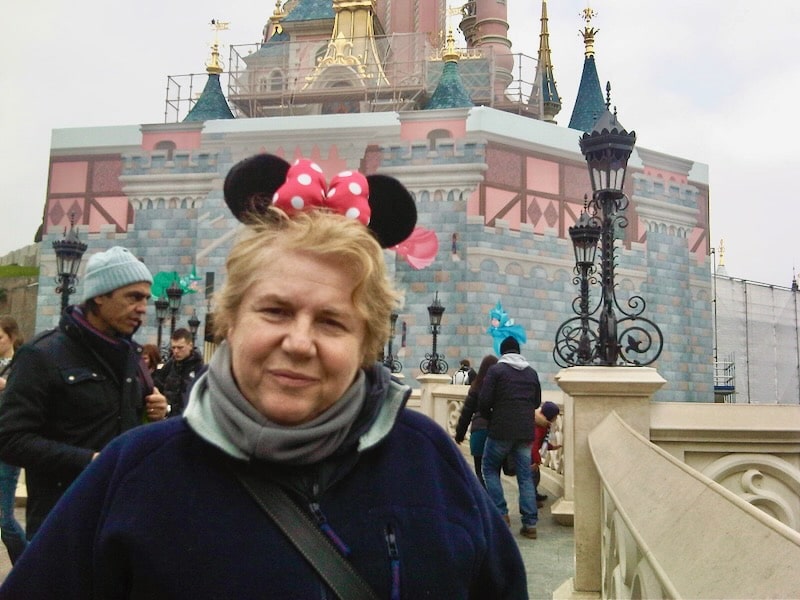 In Disneyland wearing Mickey ears: one of the best things to do in Paris (December)